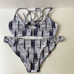 White and purple two-piece bikini set.